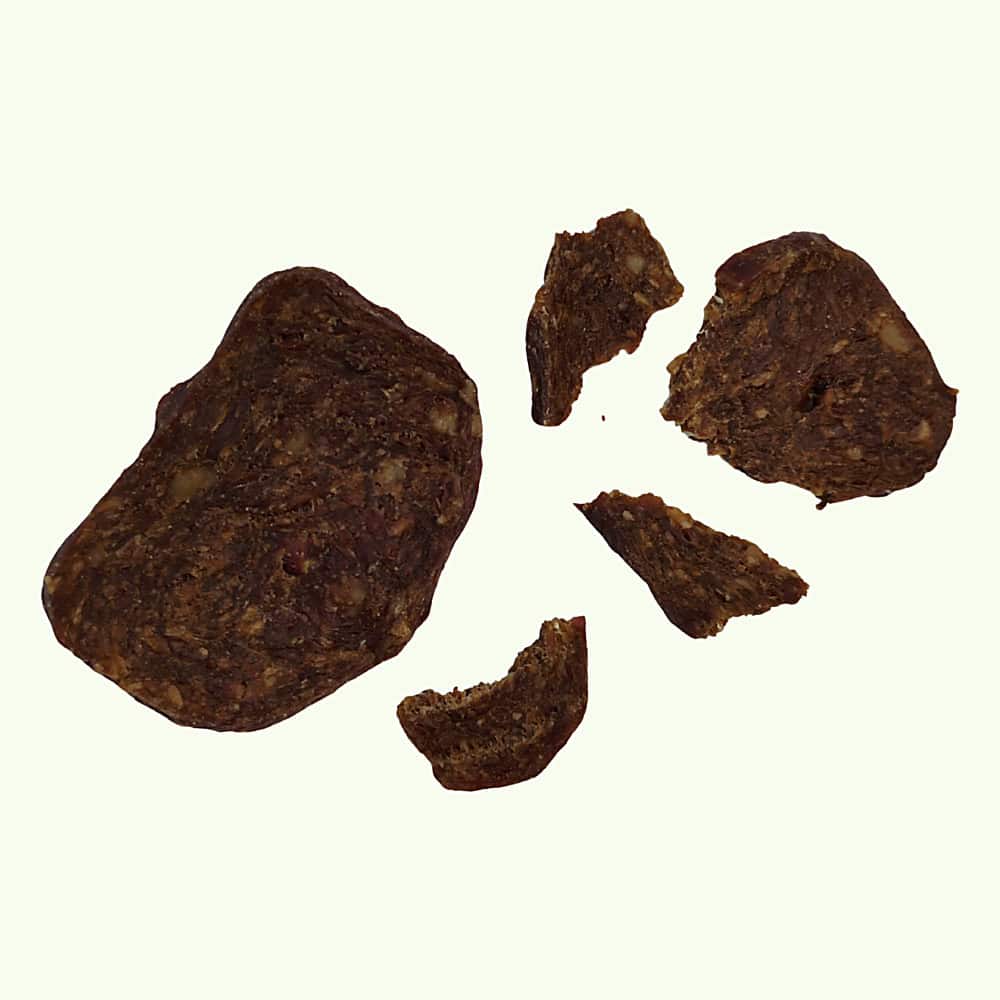 A duck and chicken grill broken into smaller pieces, showing how it snaps into training treats