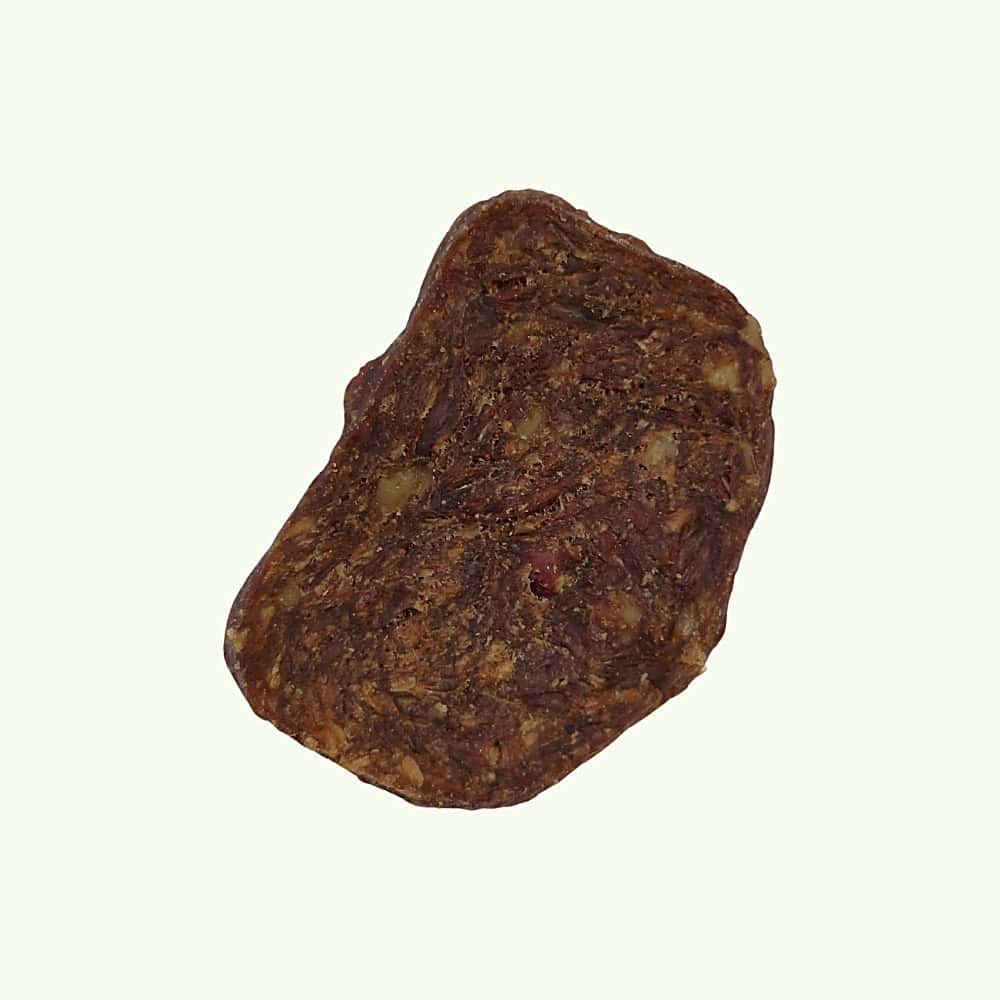 A duck and chicken grill dog treat, on a light green background.